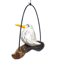 Wei&szlig;er Vogel aus Holz, kleine M&ouml;we auf Schaukel